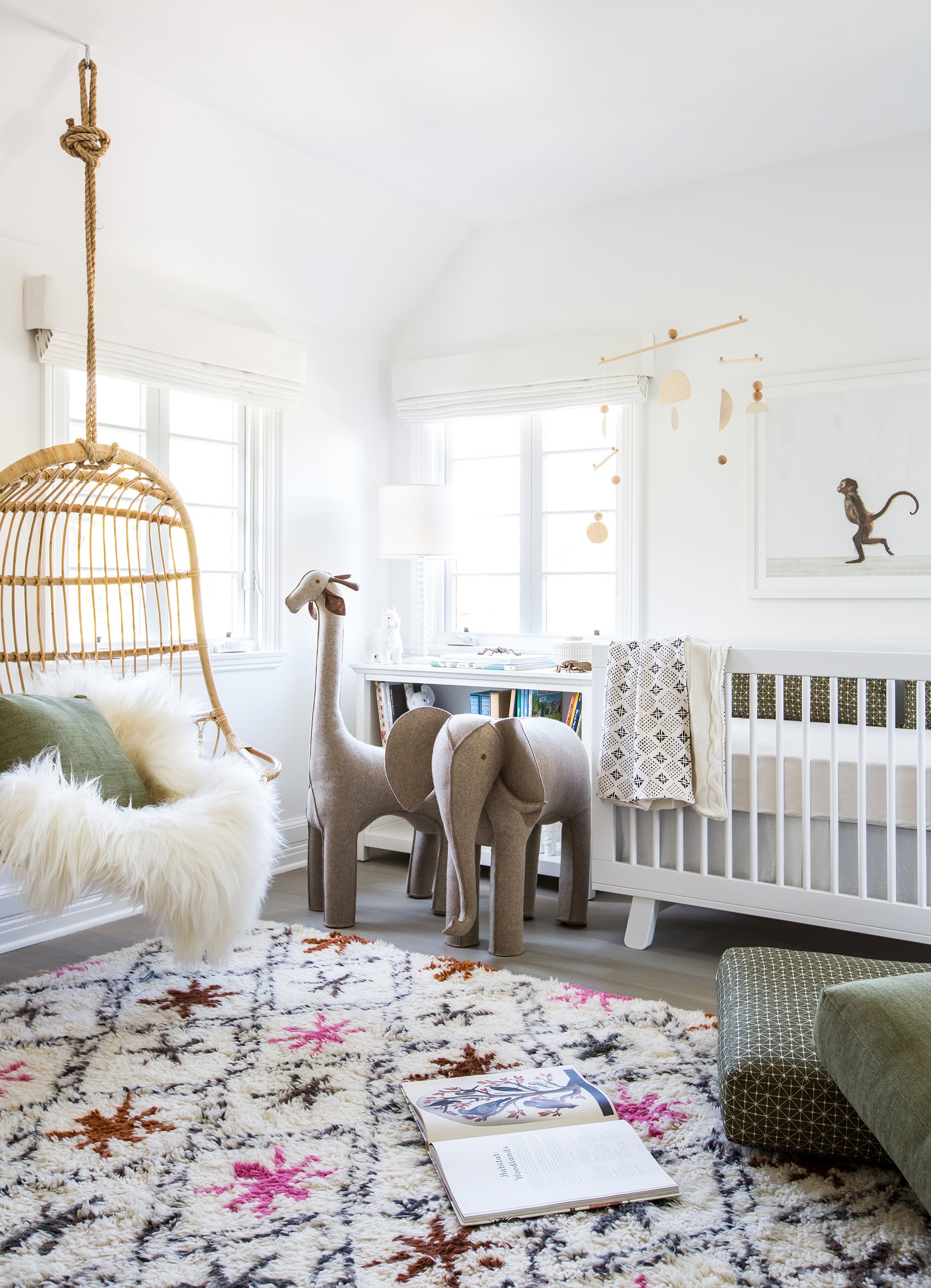 fluffy rug in a nursery with a gray giraffe and elephant