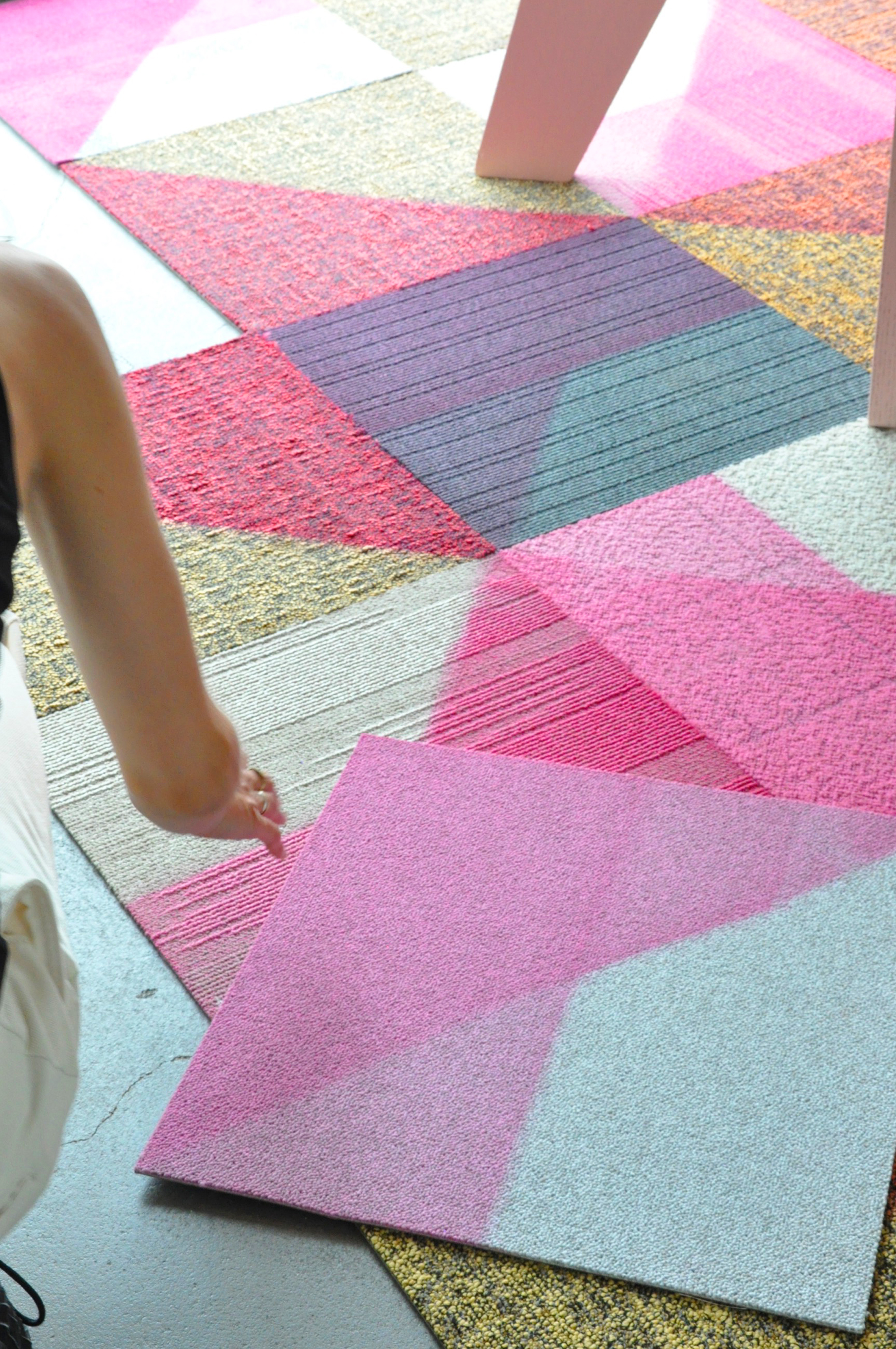 person moving floor tiles