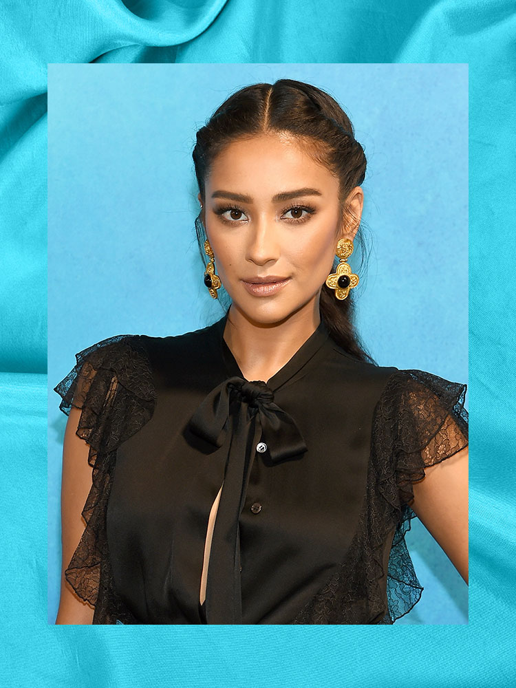 shay mitchel on a blue background