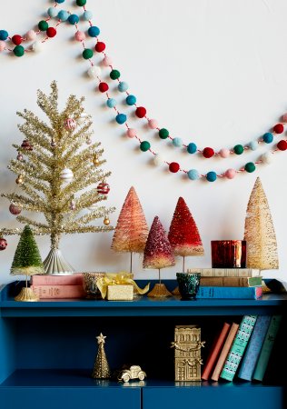 blue-bookshelf-colorful-christmas-decorations