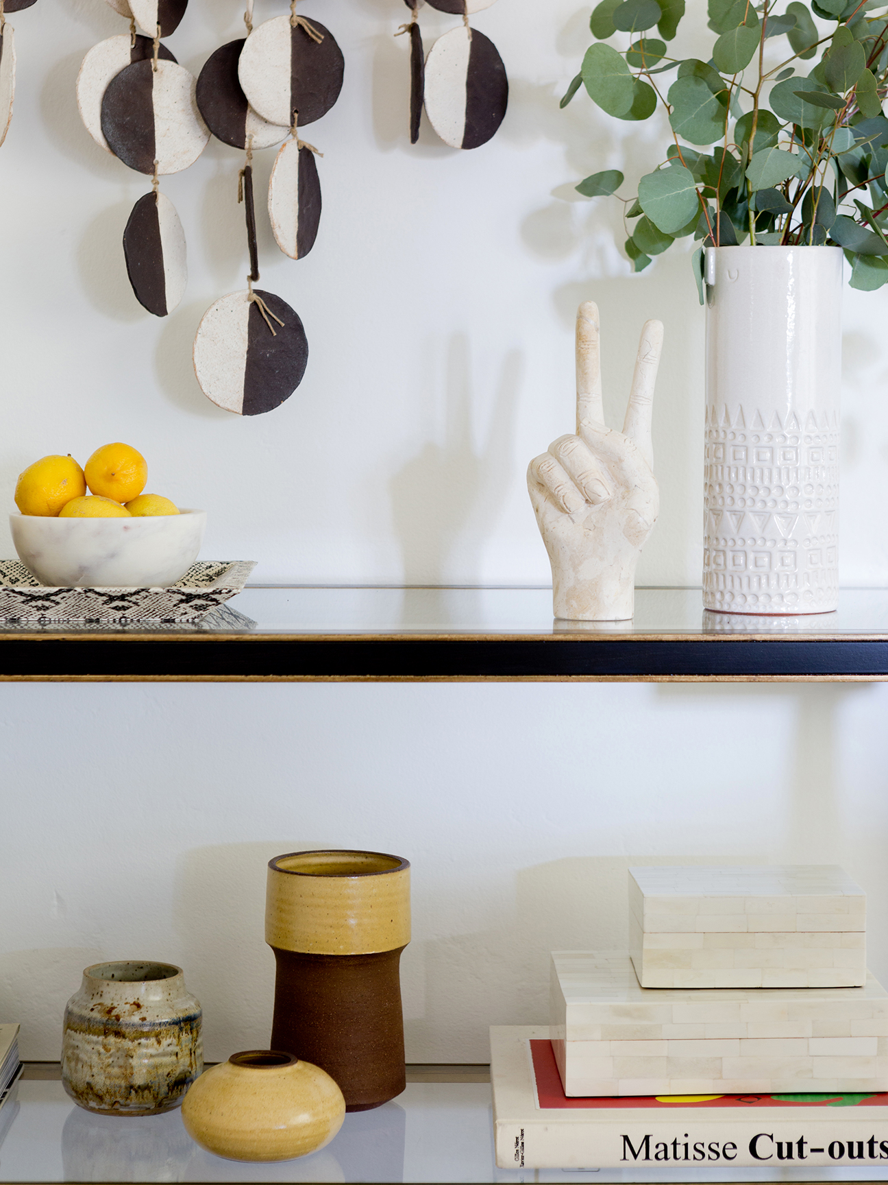 knicknacks sitting on a white shelf