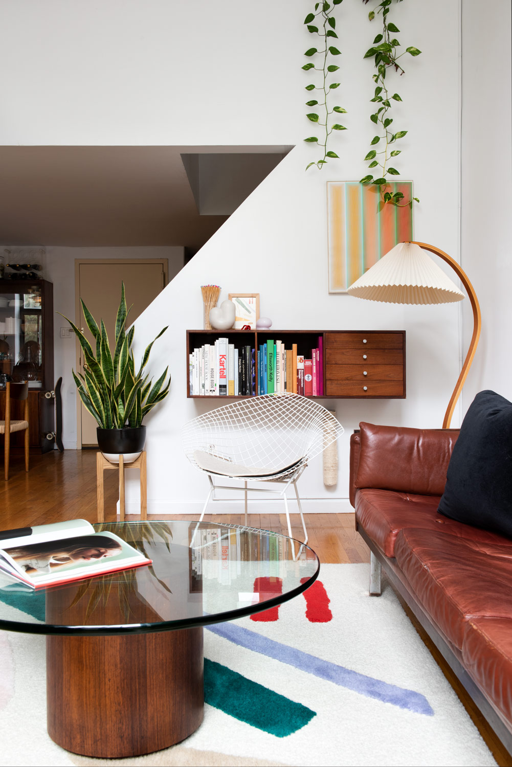 Mid-century bookcase hung on a wall