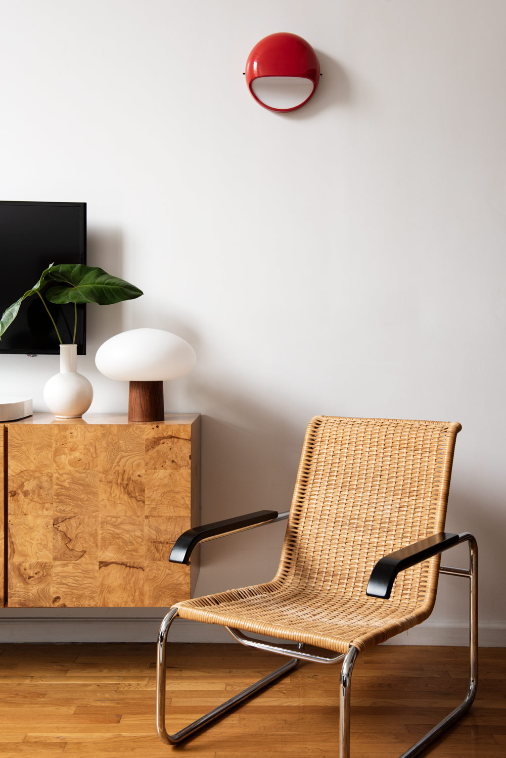 Marcel Breuer chair next to Milo Baughman credenza