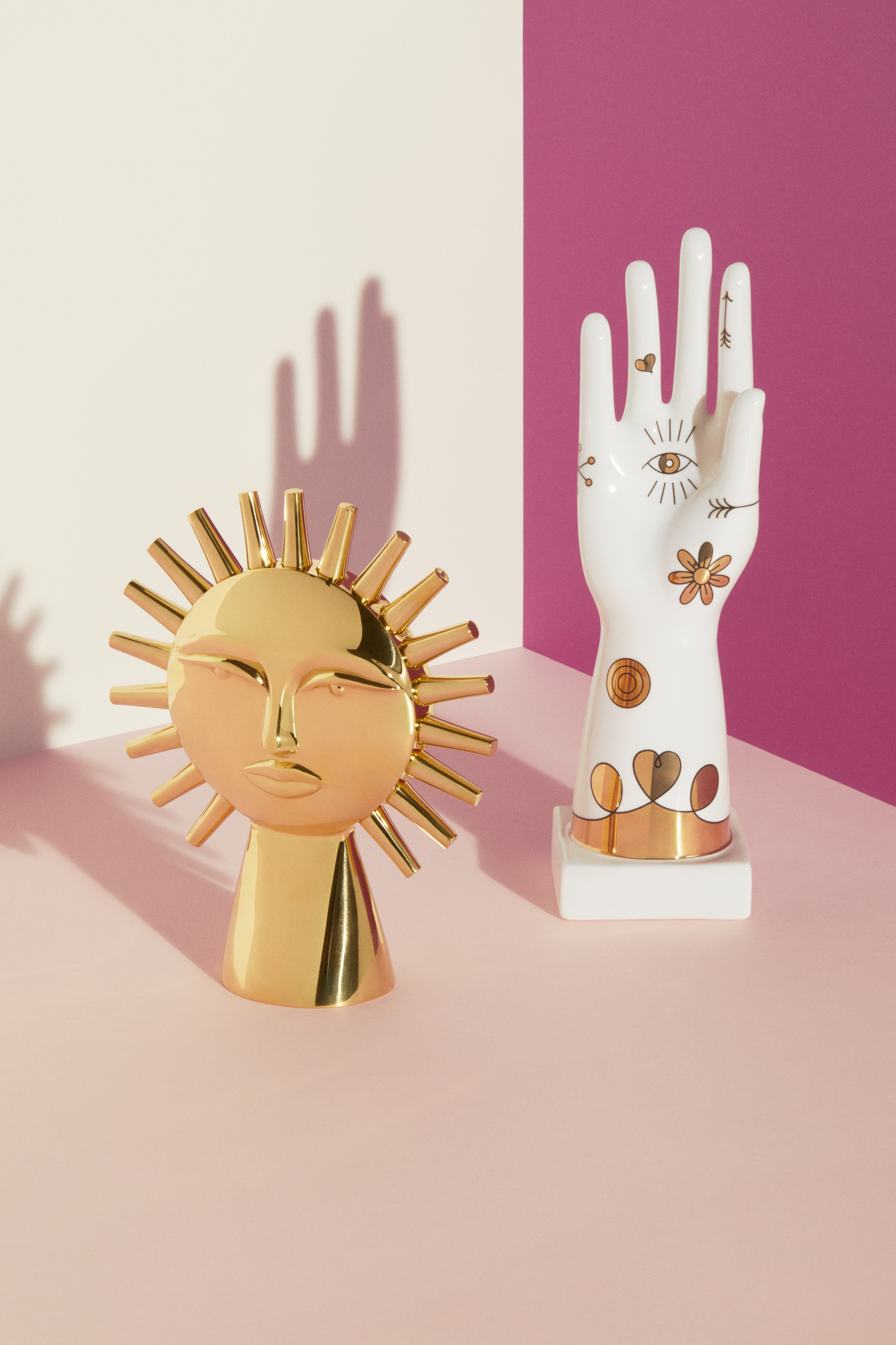 gold-sun-white-hand-sculptures