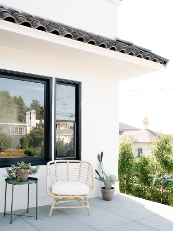 White exterior of a Spanish-style home