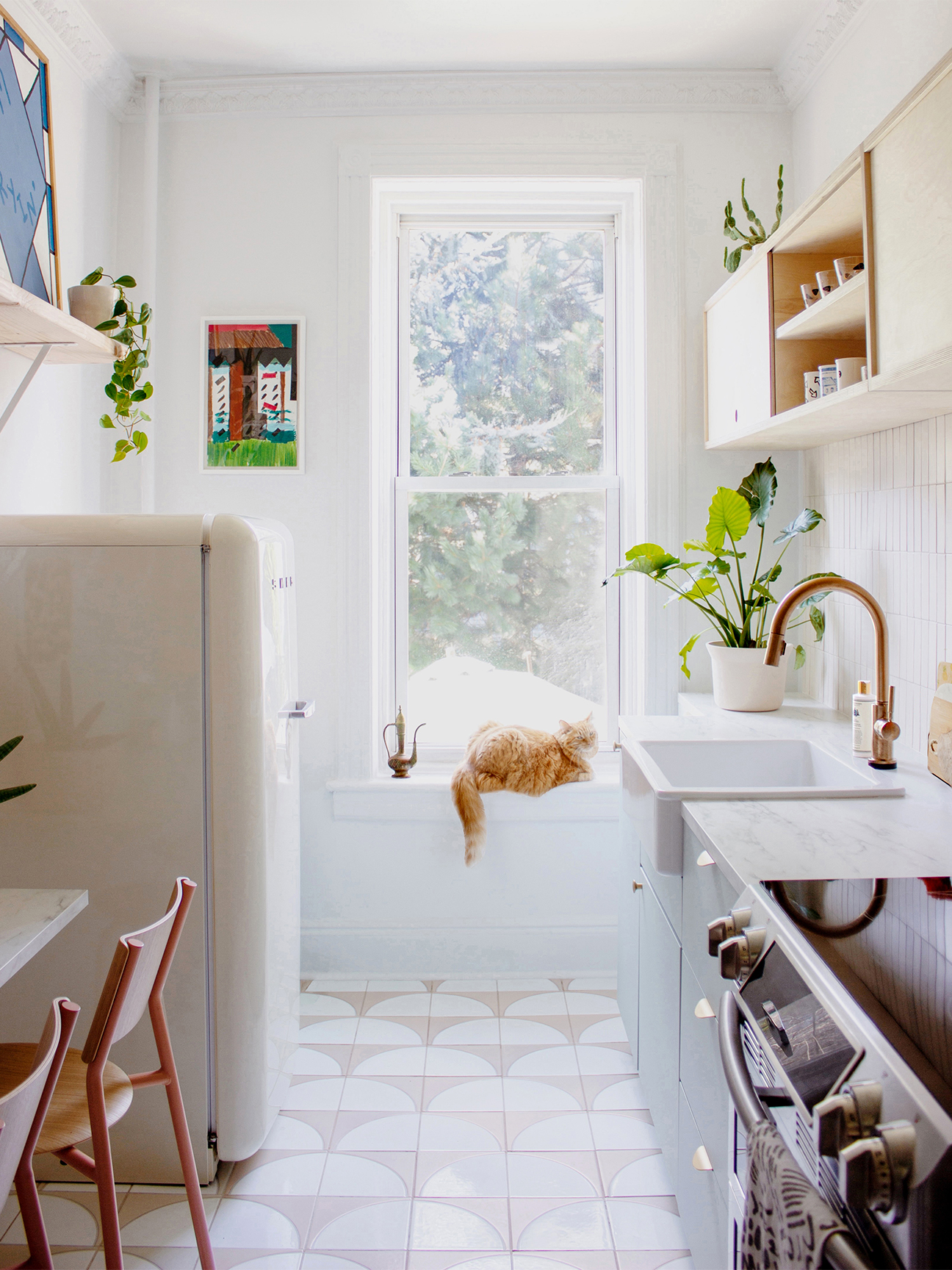 bright white kitchen with sculptural floor tile pattern