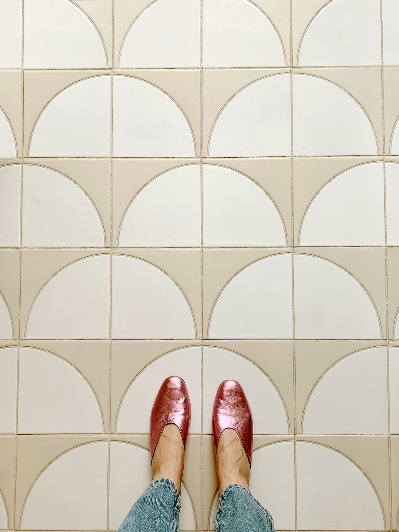 pink shoes against floor tiles