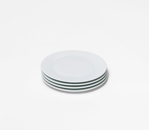  stack of four small white plates