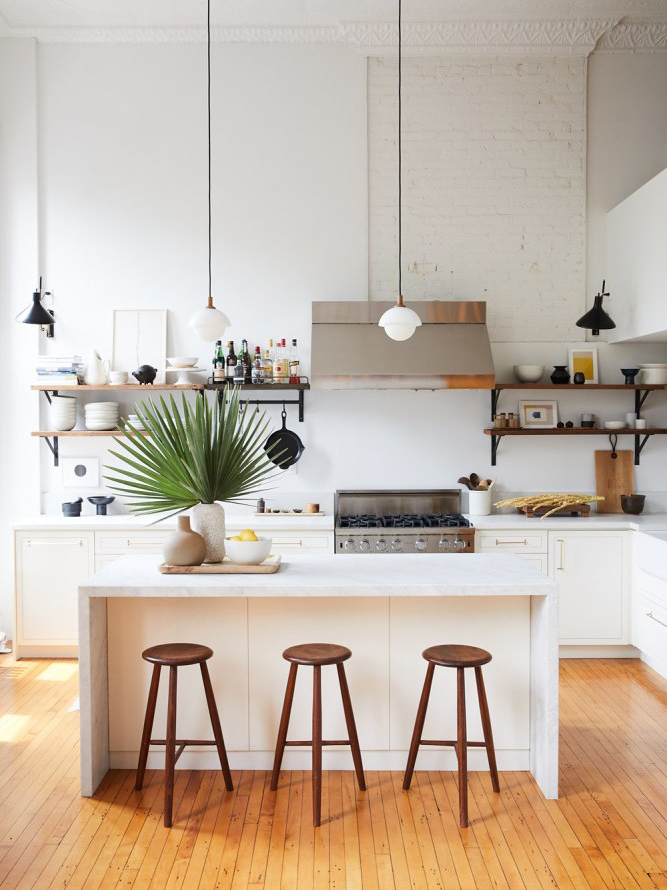 NYC loft with wood floors and white eat in island