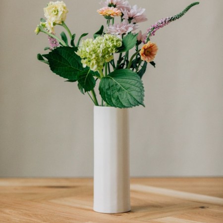  simple white vase with floral arrangement