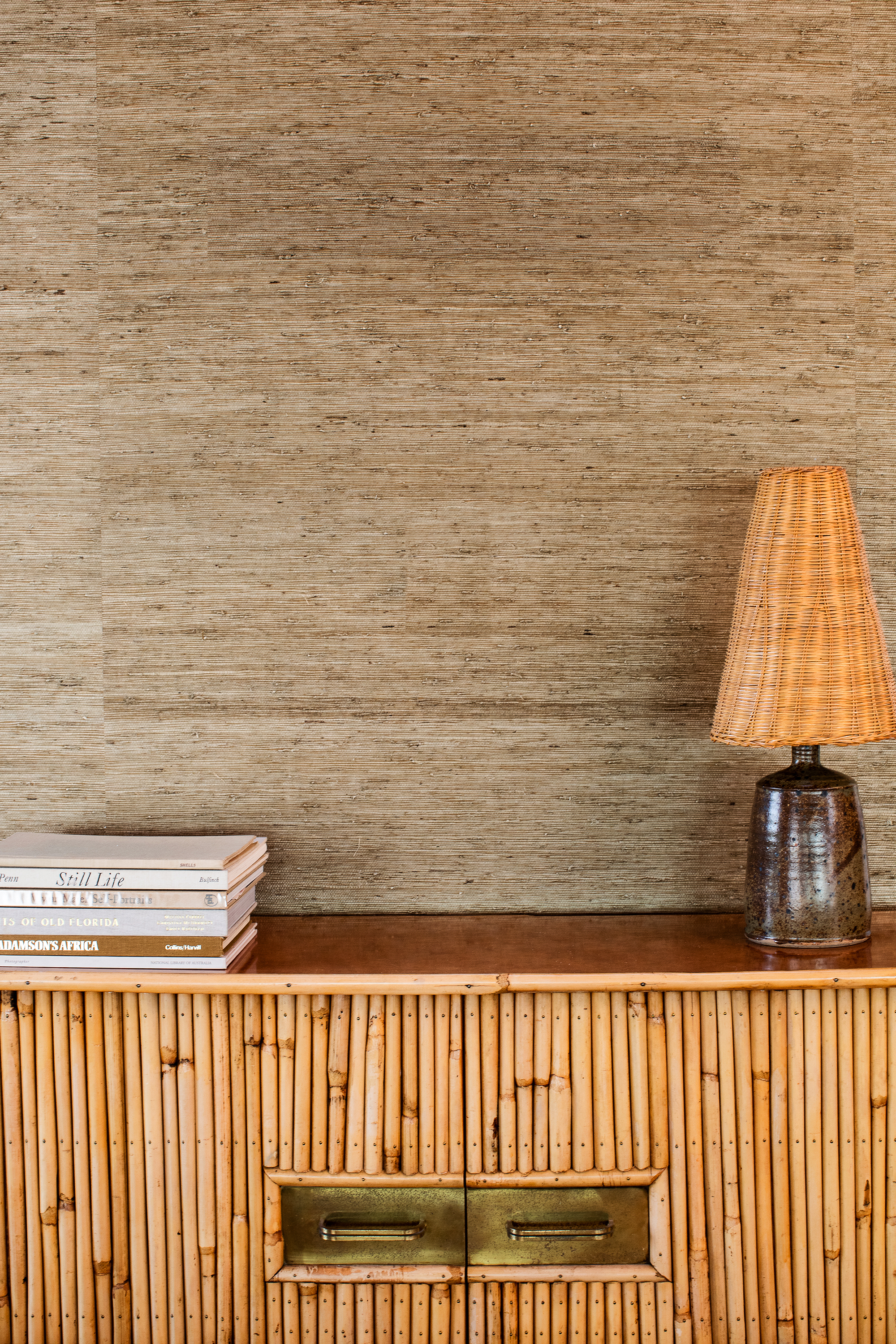 lamp and book stack on a table