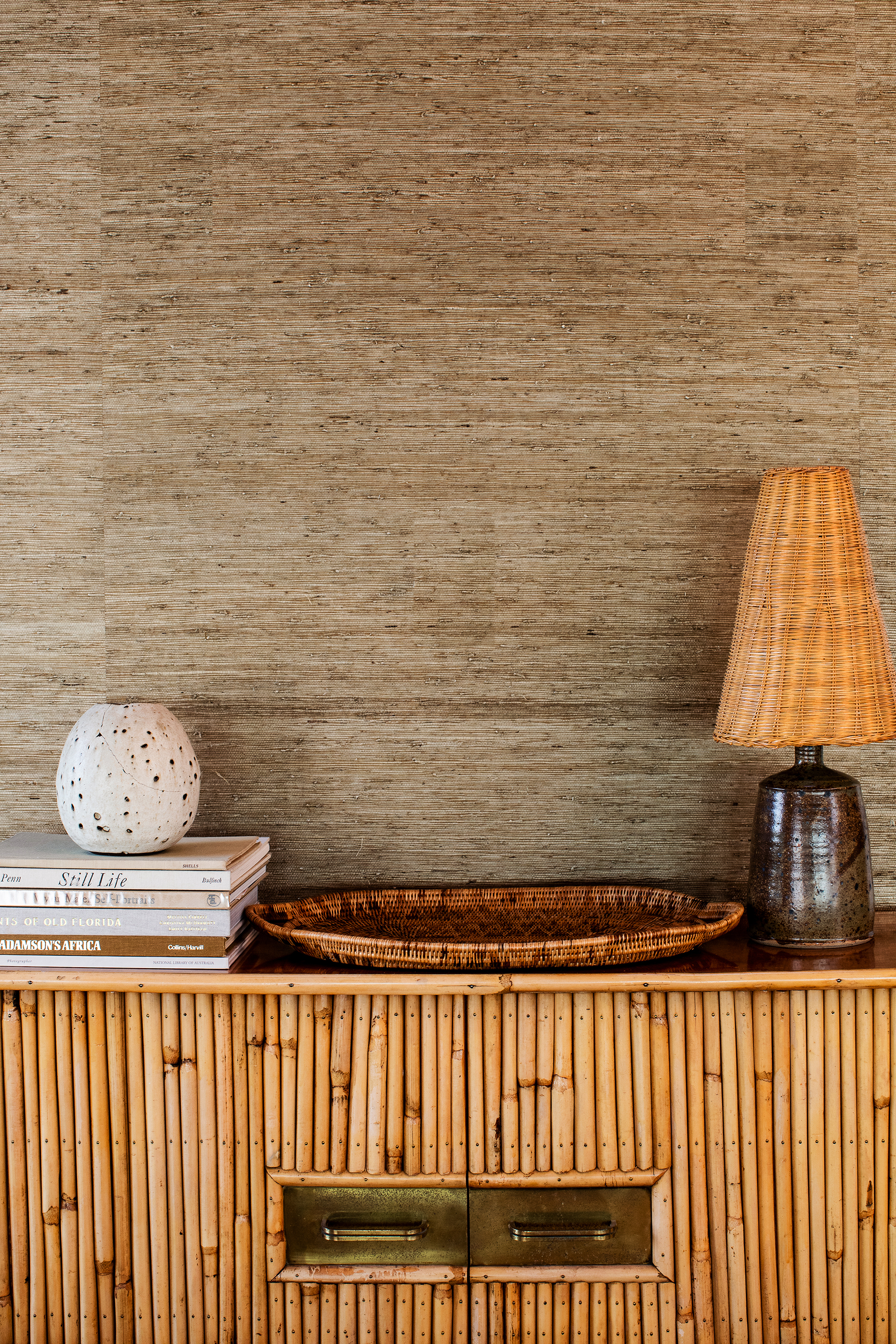 tray and lamp and small book stack on table