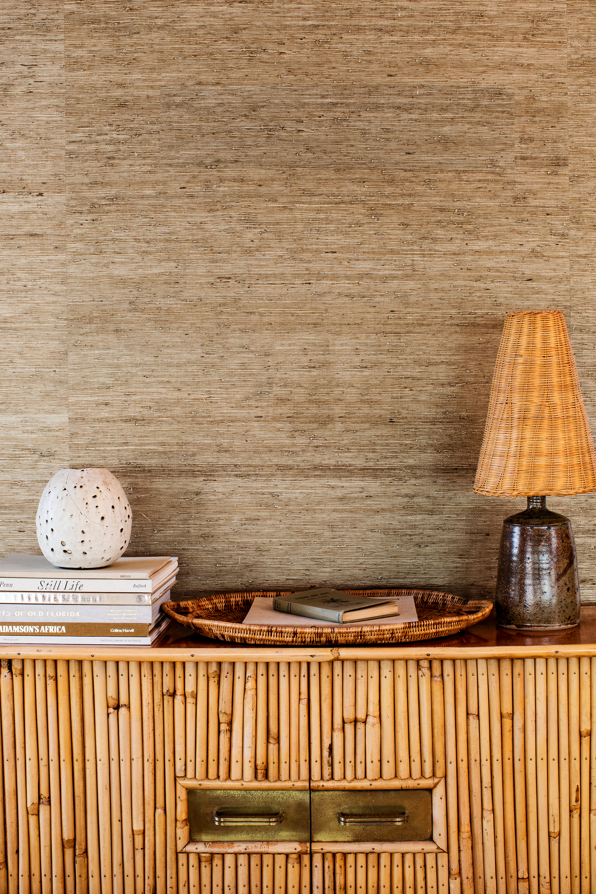 tray and lamp and small book stack on table