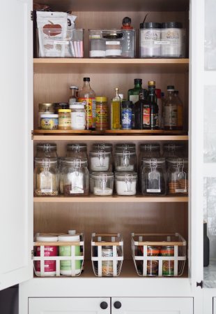 after photo of a tidy pantry cabinet with shelves