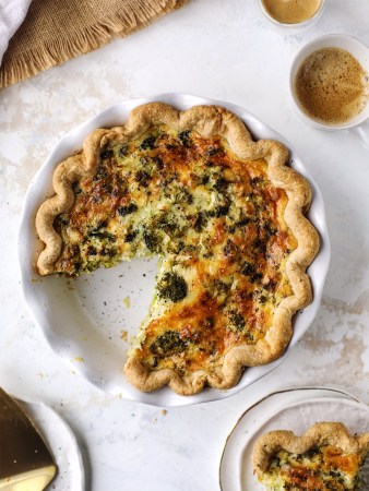 broccoli and cheddar quiche served in white dish