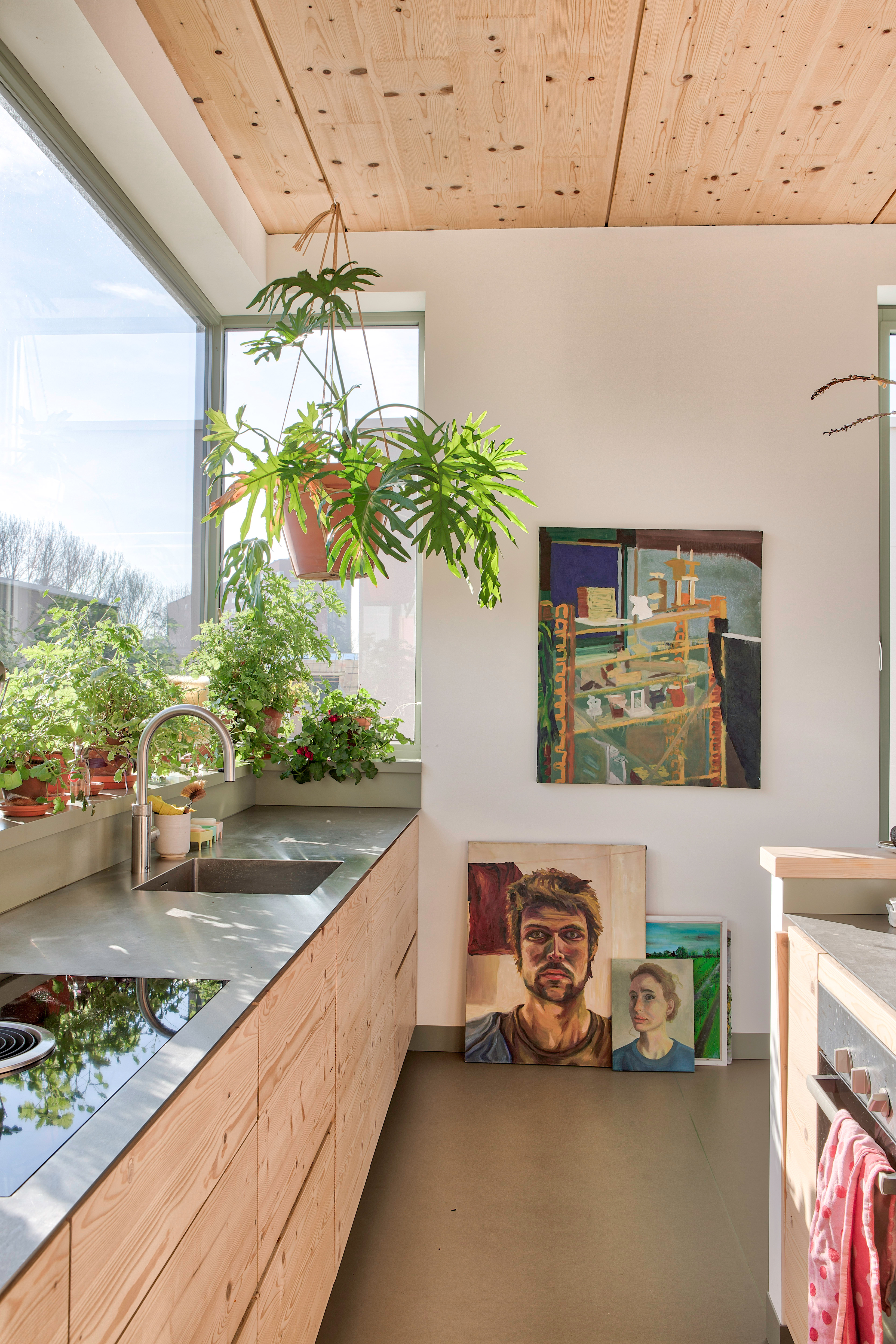 Bright kitchen with wooden cabinets and wood slat ceiling