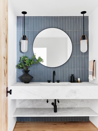 blue bathroom tile with white marble floating vanity