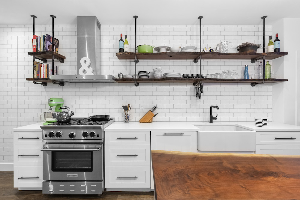 White kitchen with live edge island and shelves