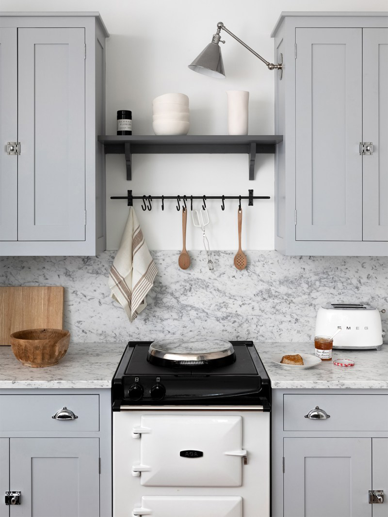 cool gray cabinets with marble backsplash and hook bar