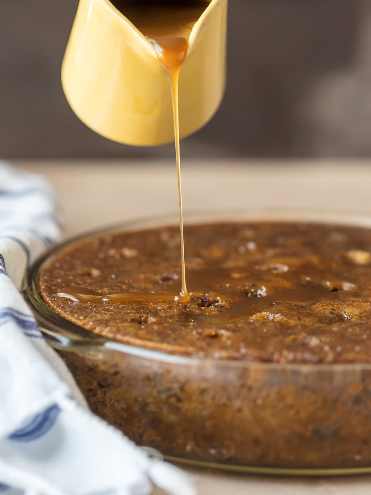 toffee pudding cake with sauce drizzled over it