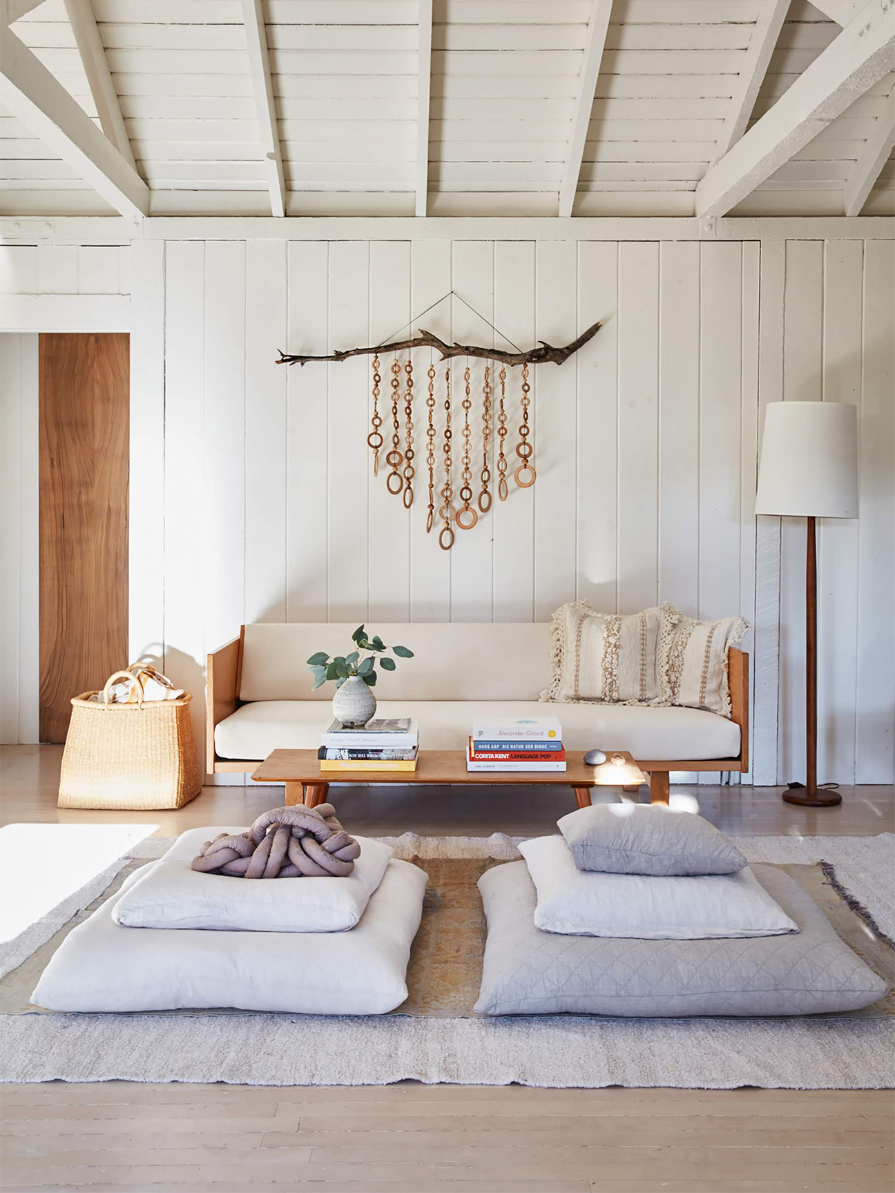 Small living room with Hans Wegner sofa and floor pillows