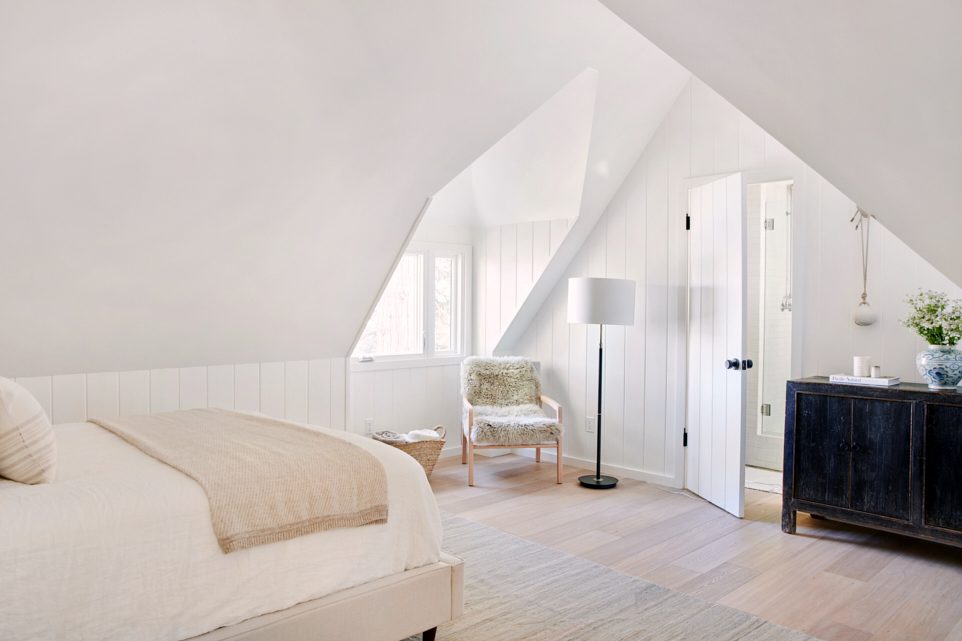 White bedroom with pitched ceiling