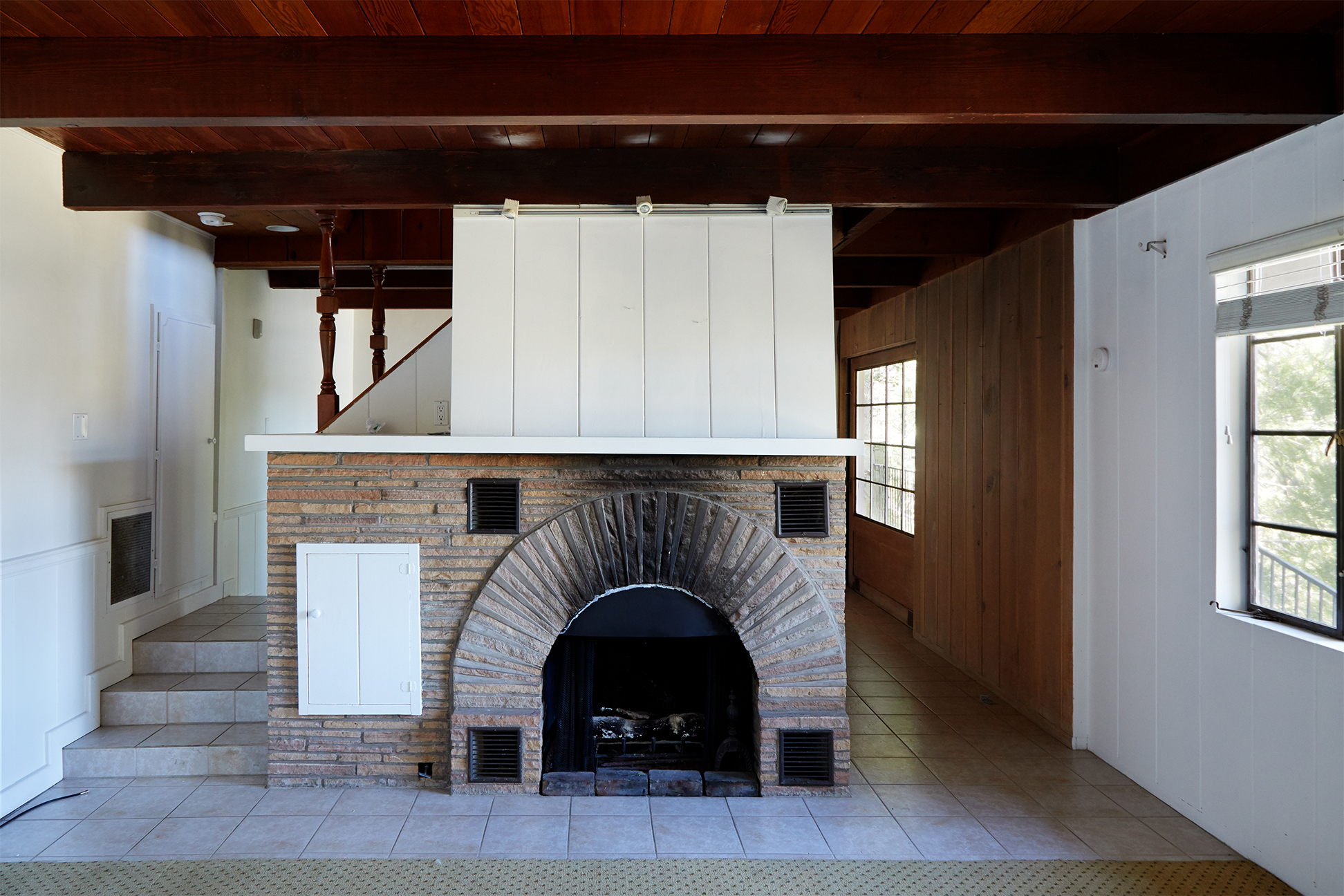 Dark basement with fireplace