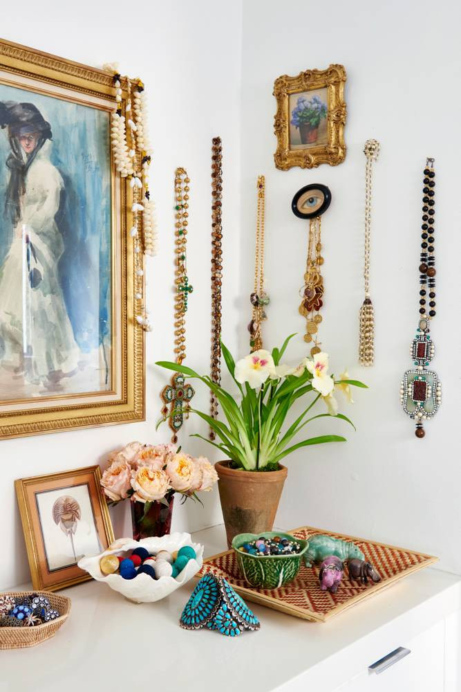 jewelry and necklaces hanging on wall hooks