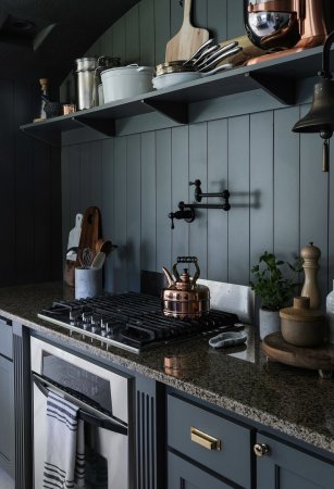 dark kitchen walls with range and open shelf