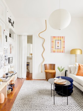 Living Room With White Sofa and Navy Pouf