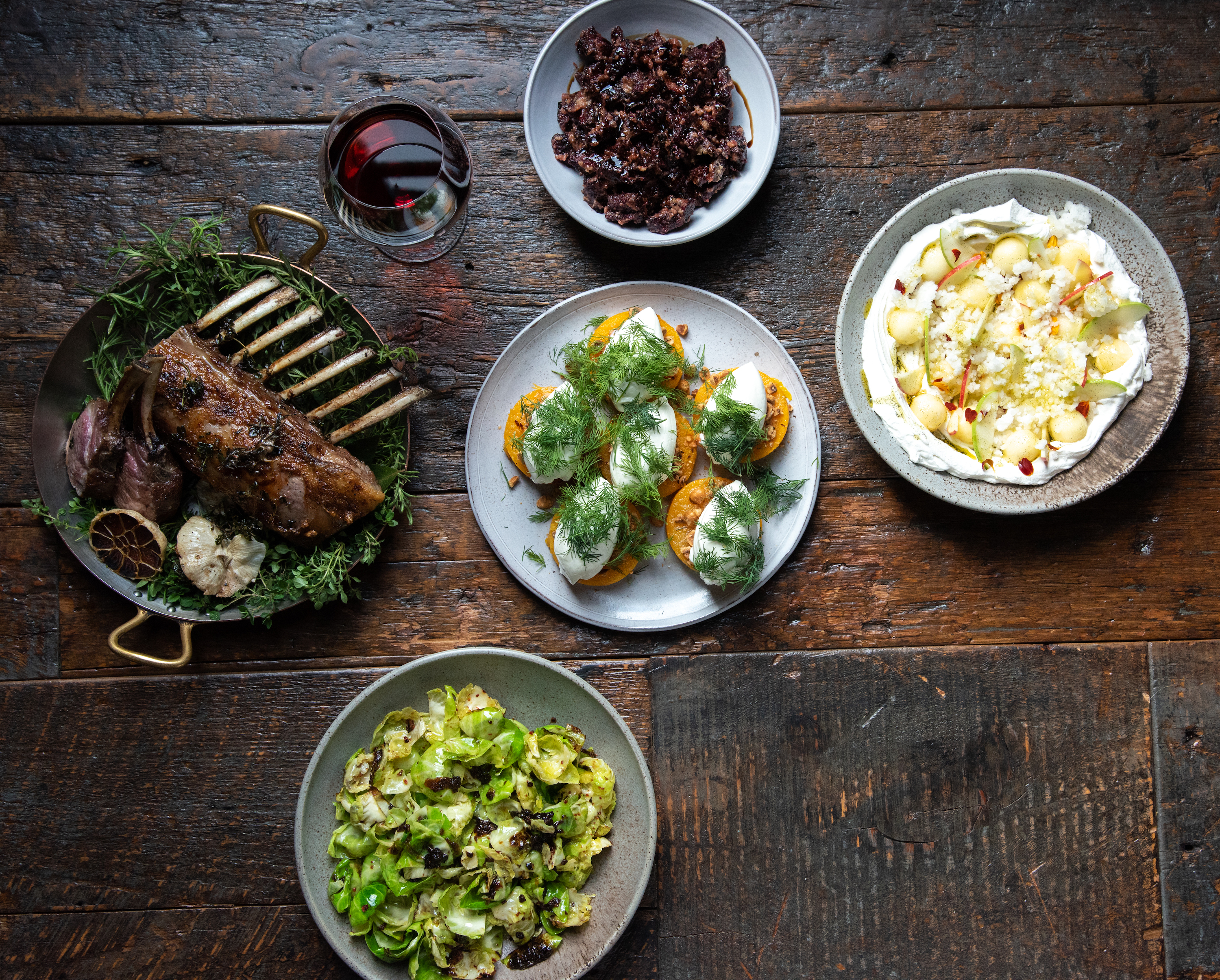 farm to table dishes on a wood dining table