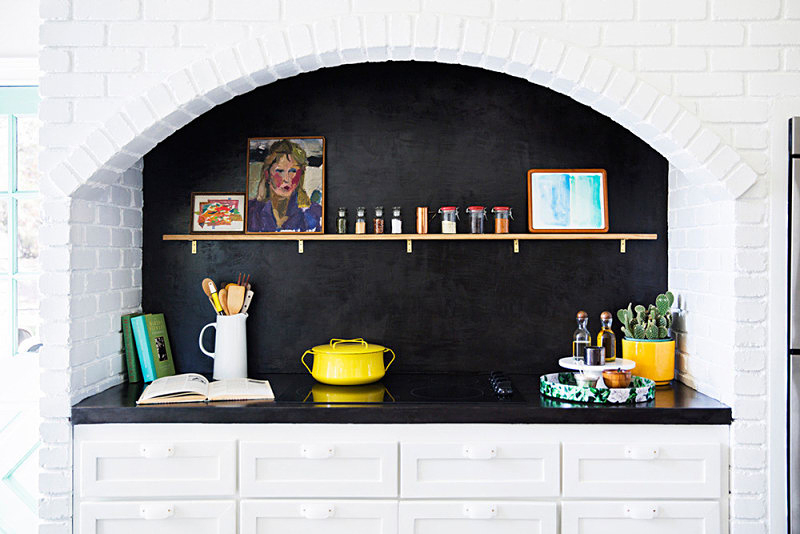 black alcove with white brick walls