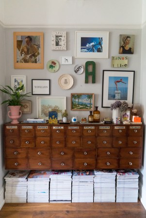 Antique cabinet with gallery wall