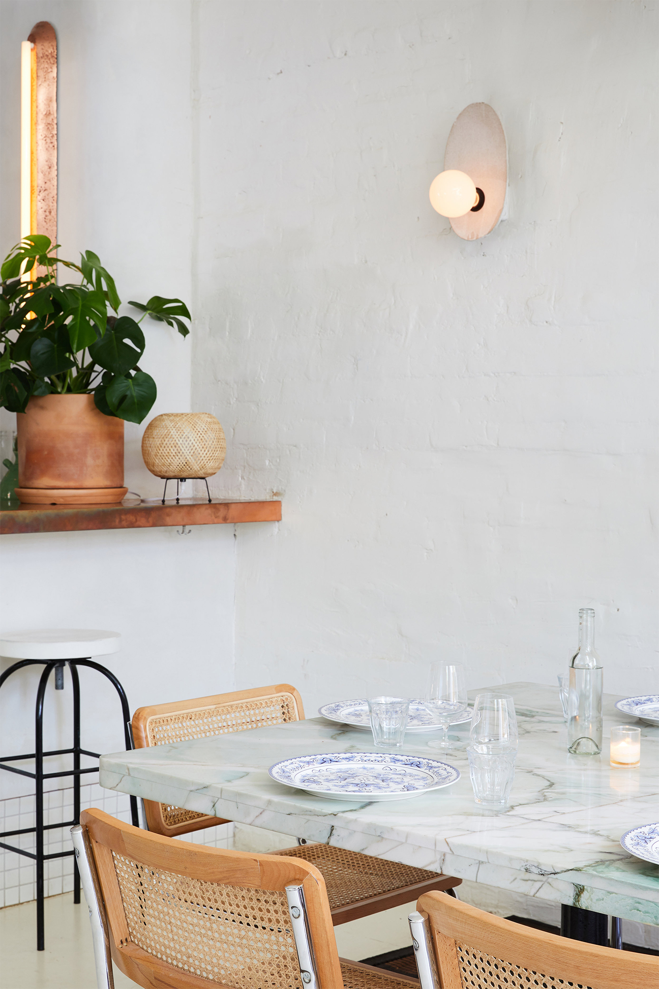 dining table nook with plaster walls