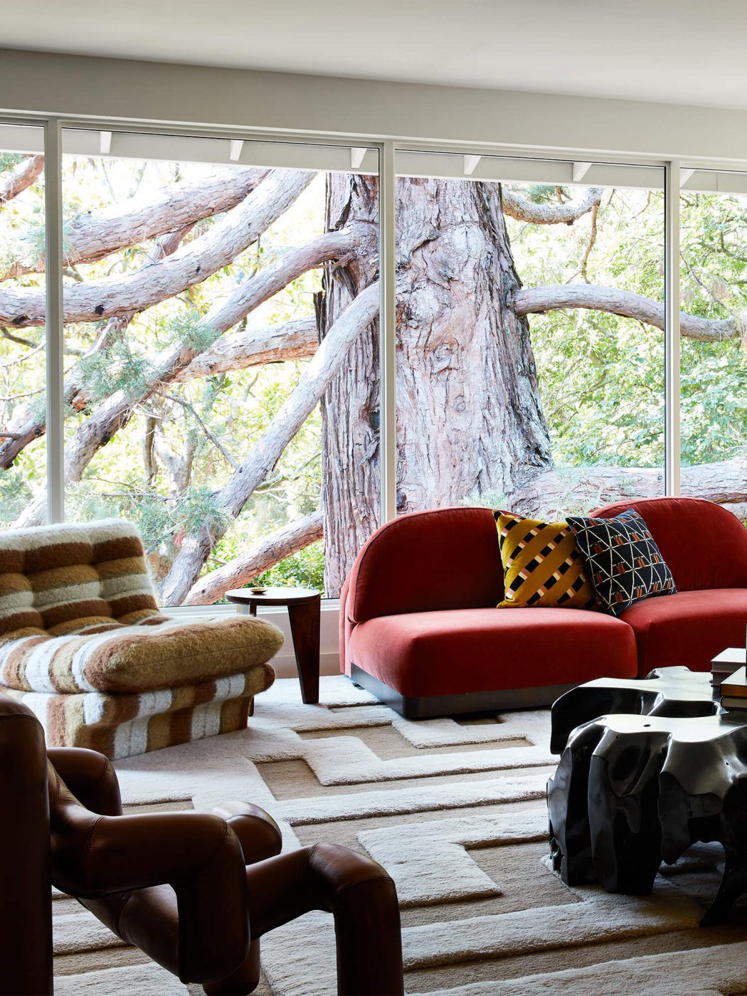 Living room with red curved velvet sectional