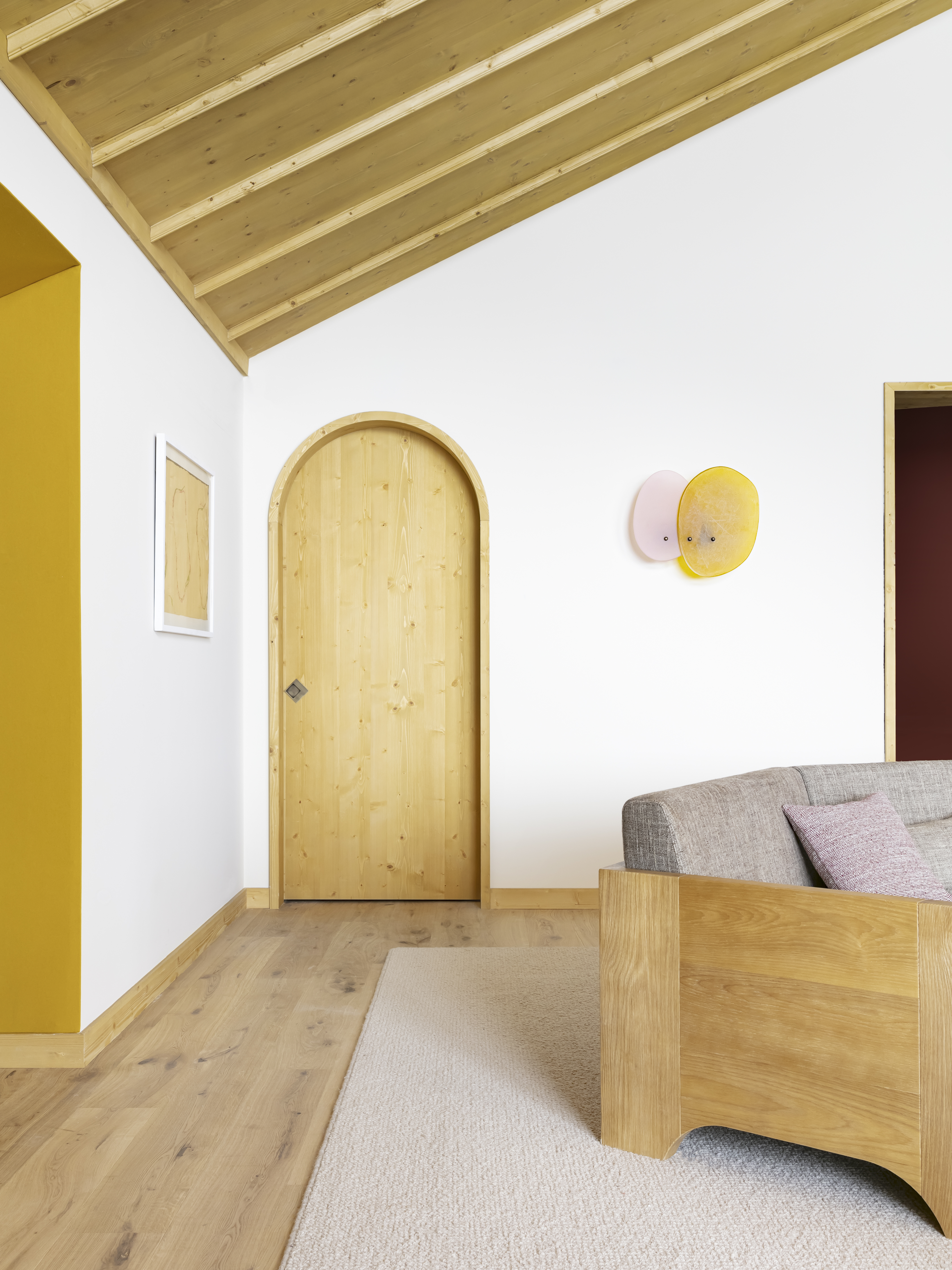 white walls with wood ceiling yellow doorway
