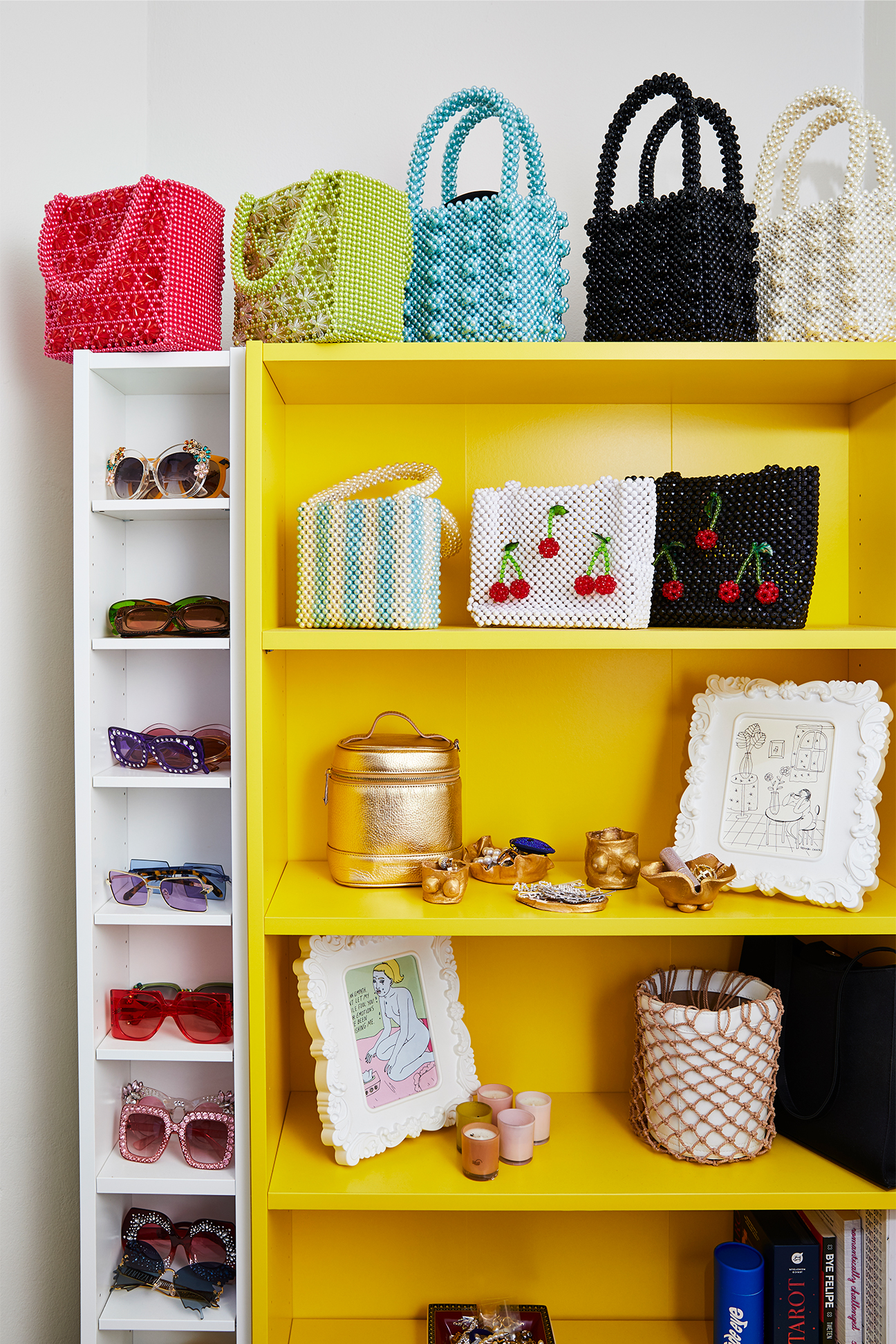 Collection of handbags and sunglasses in Flex Mami's apartment