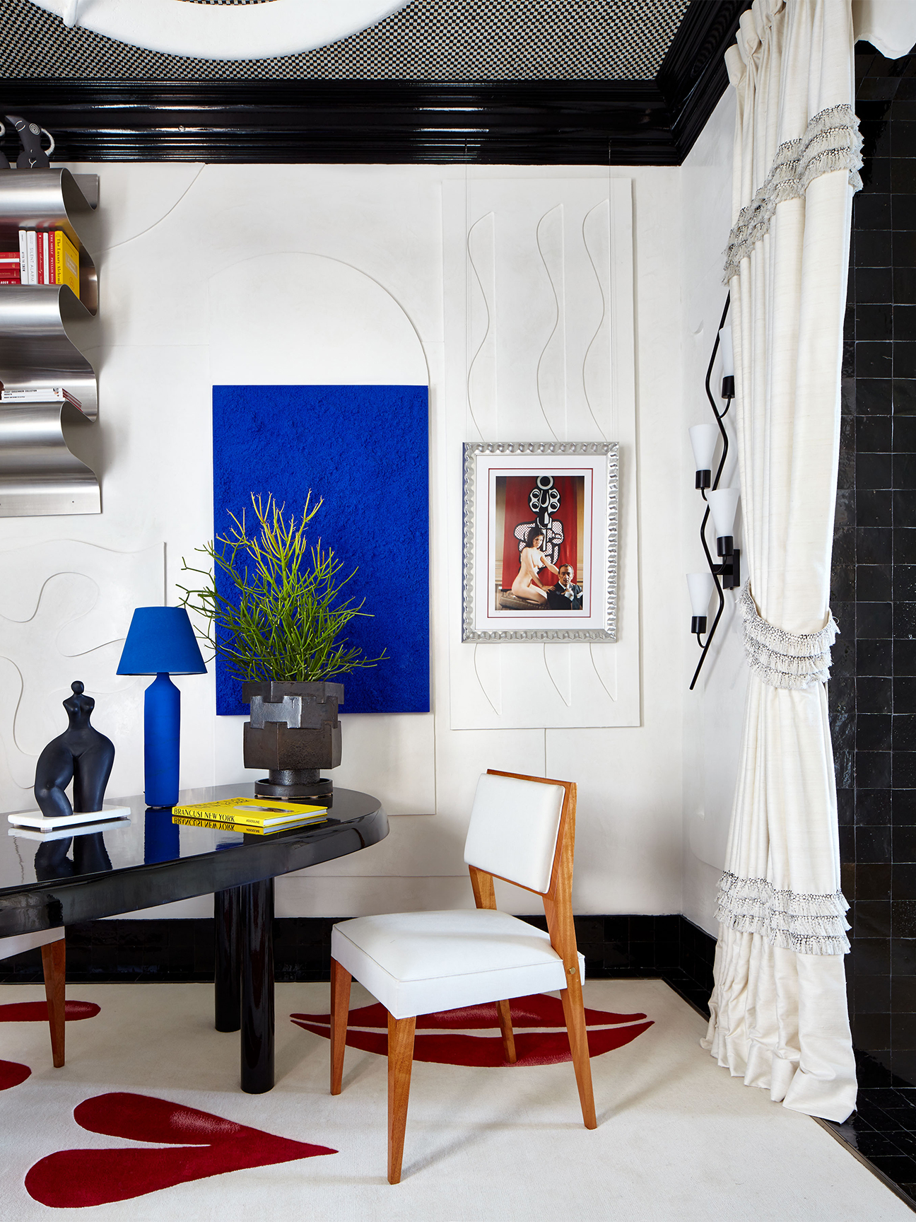 White office with Klein blue art and lamp