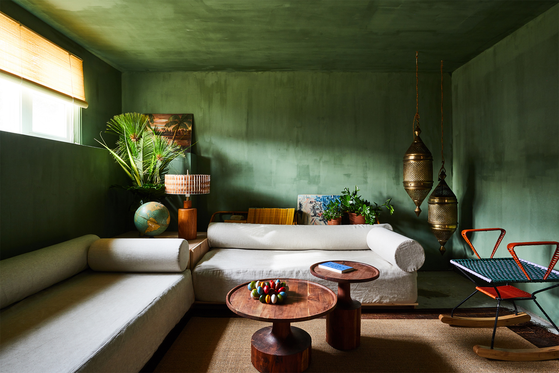 Lounge room with green walls and ceiling