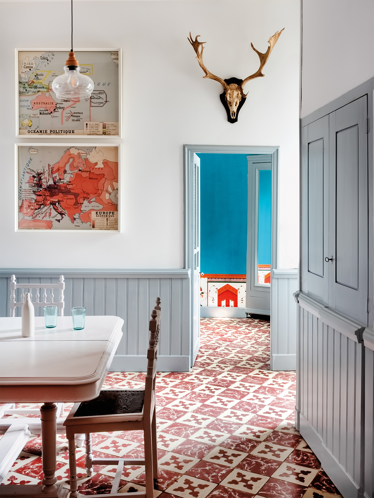 Dining room with antique tile and gray trim