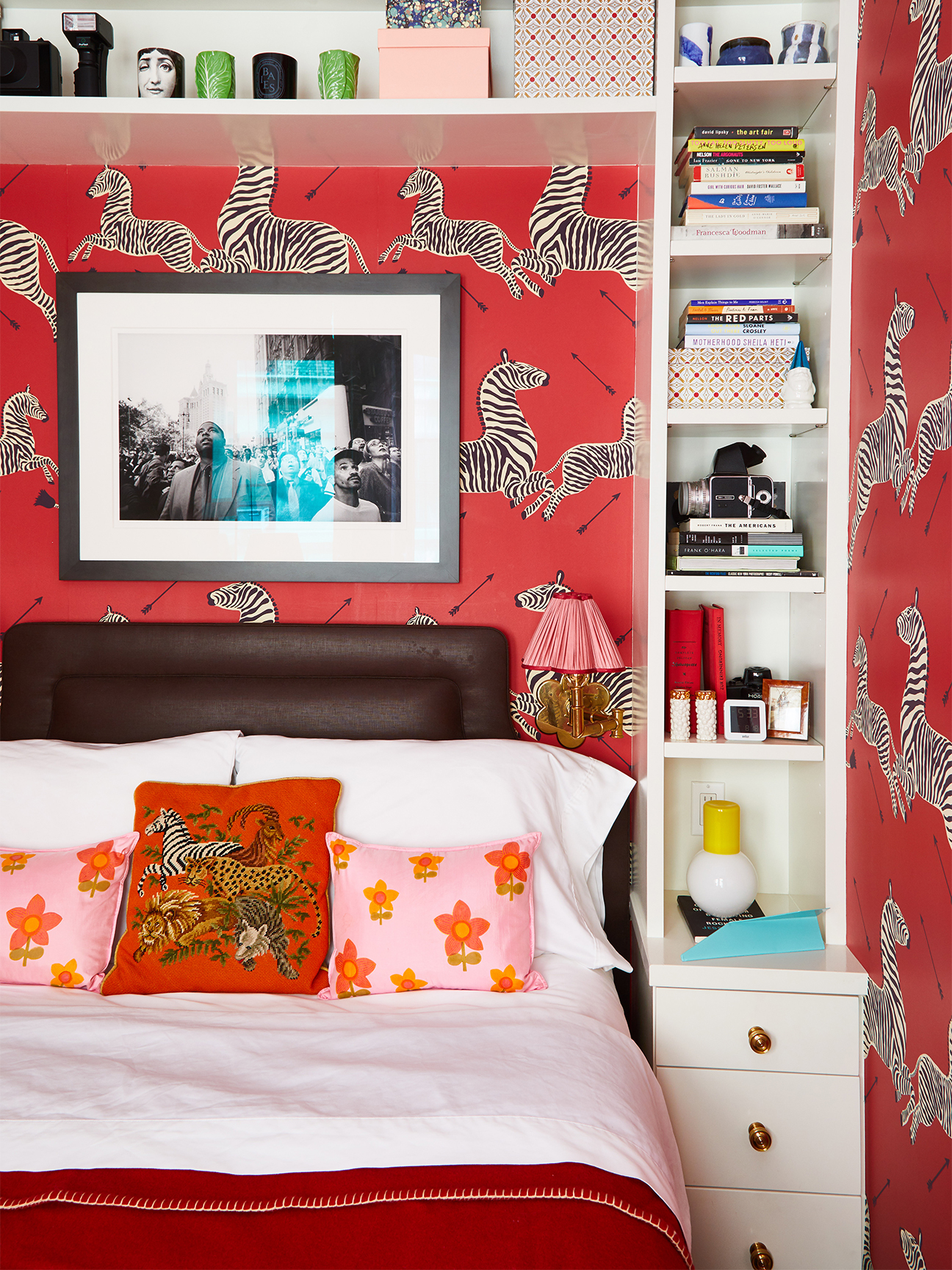 Small bedroom with red zebra wallpaper