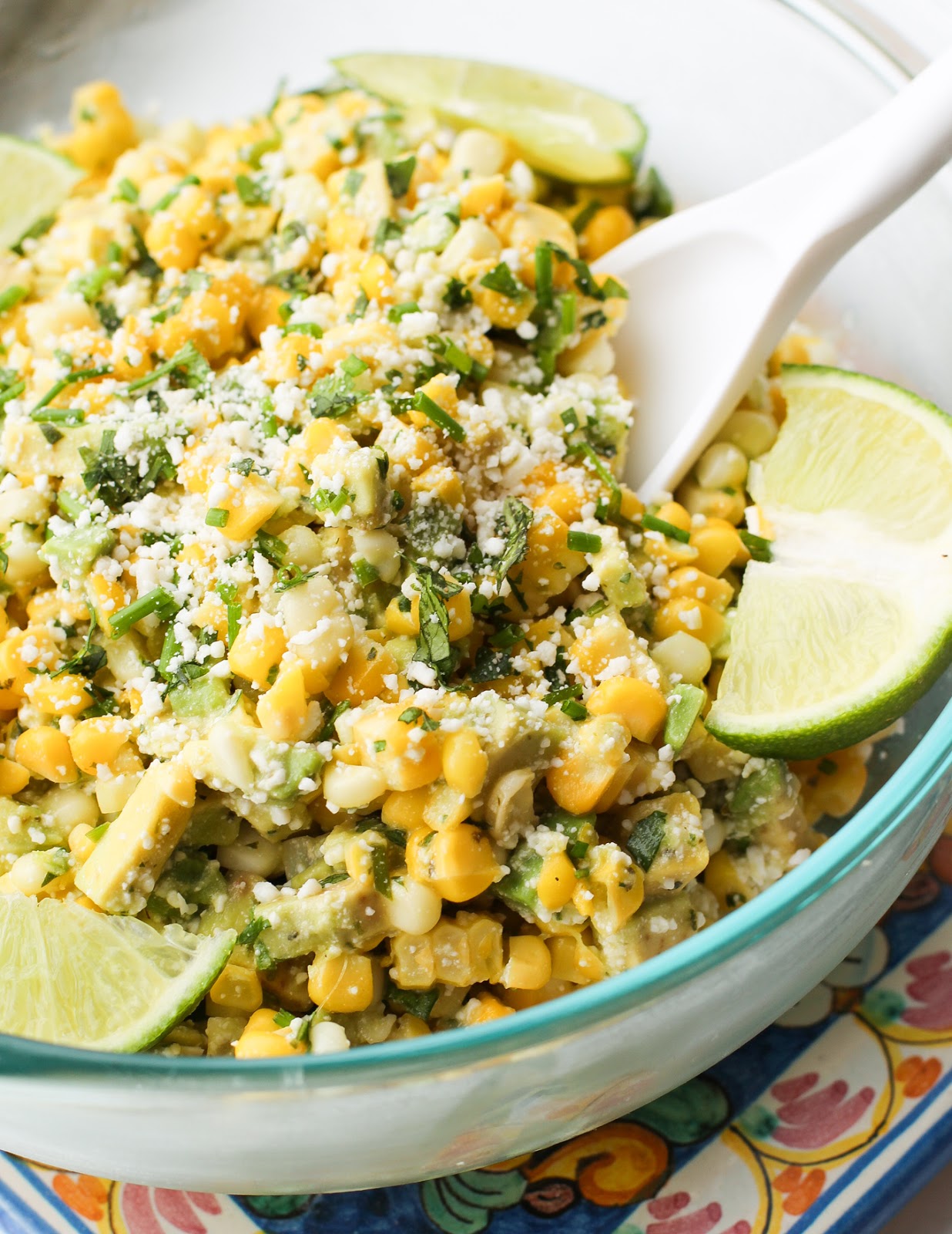 bowl of corn with a spoon in it