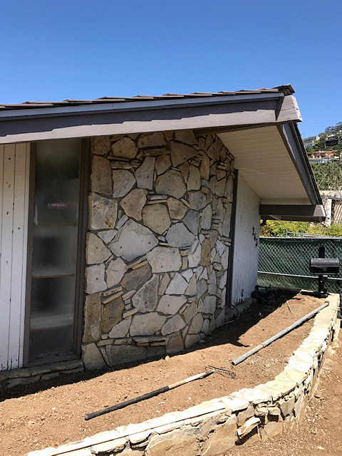 angled exterior with stone and slanted roof