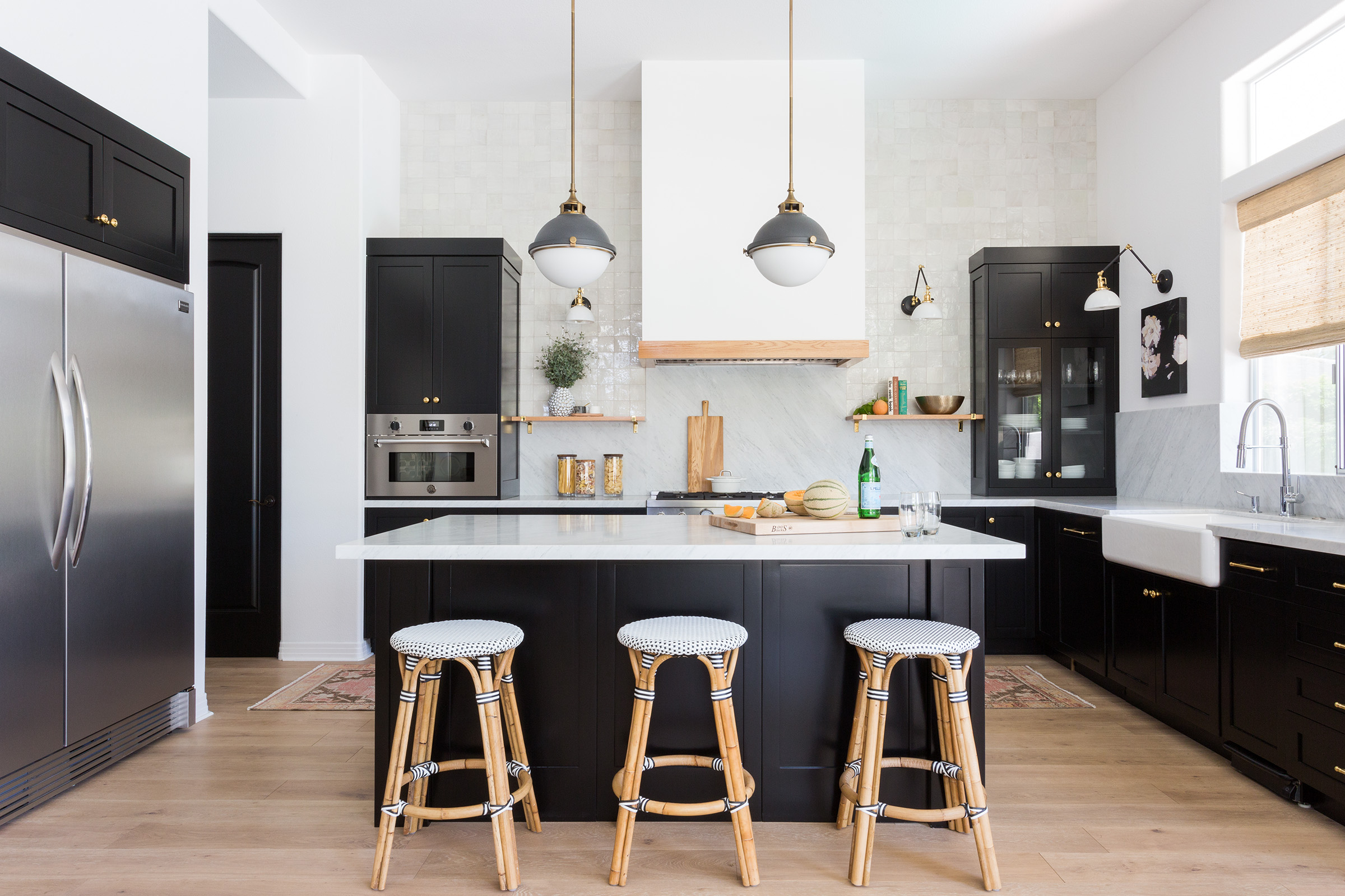 white kitchen with black painted island