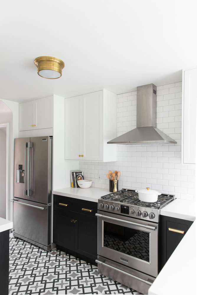 black and white kitchen with grey tiles