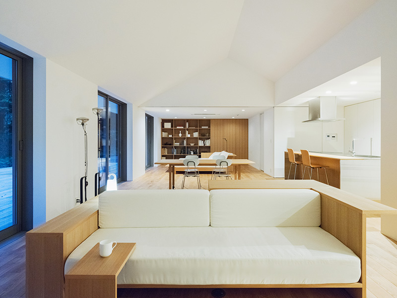 white and wood sofa with minimalist side table