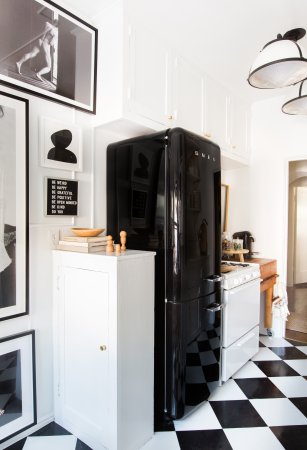 black fridge with balck and white checkered floors