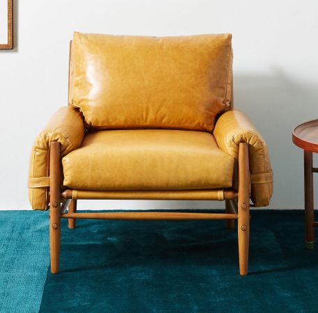 leather chair on teal rug