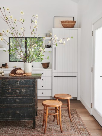 white kitchen with vintage furniture