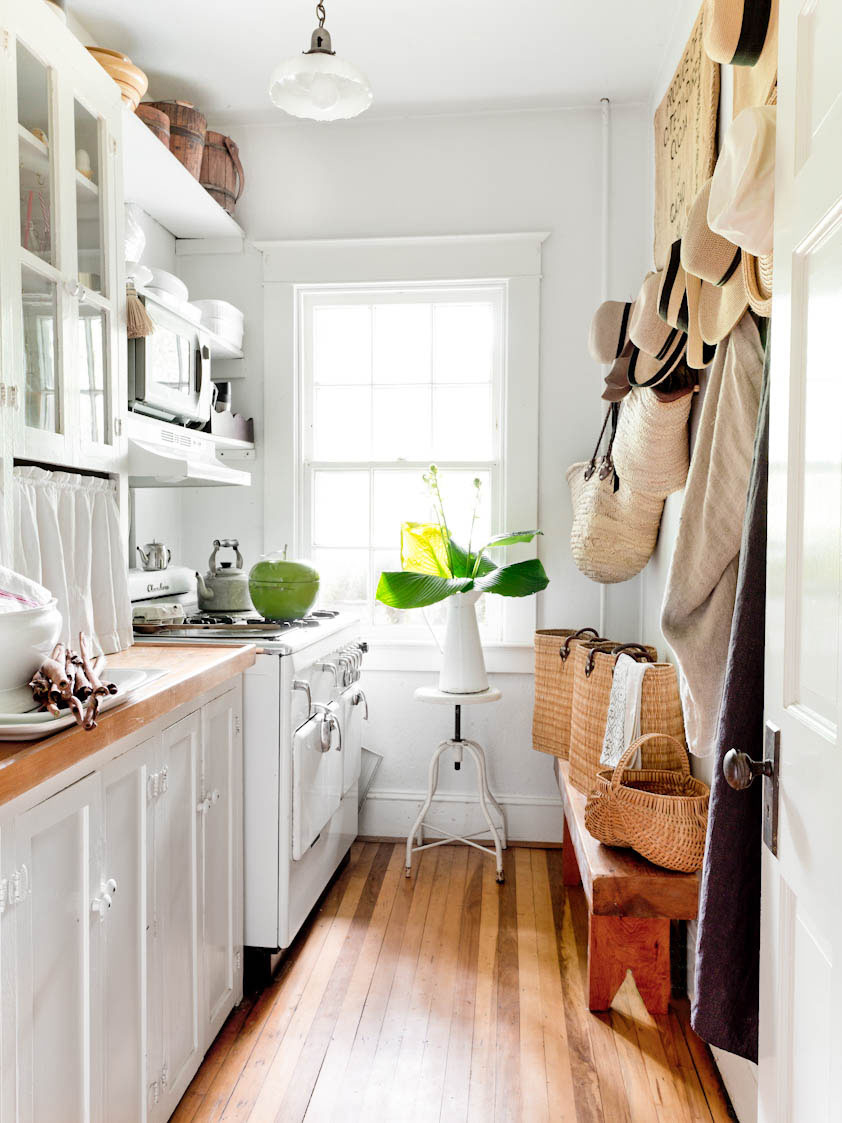 white galley kitchen with butcher block counters